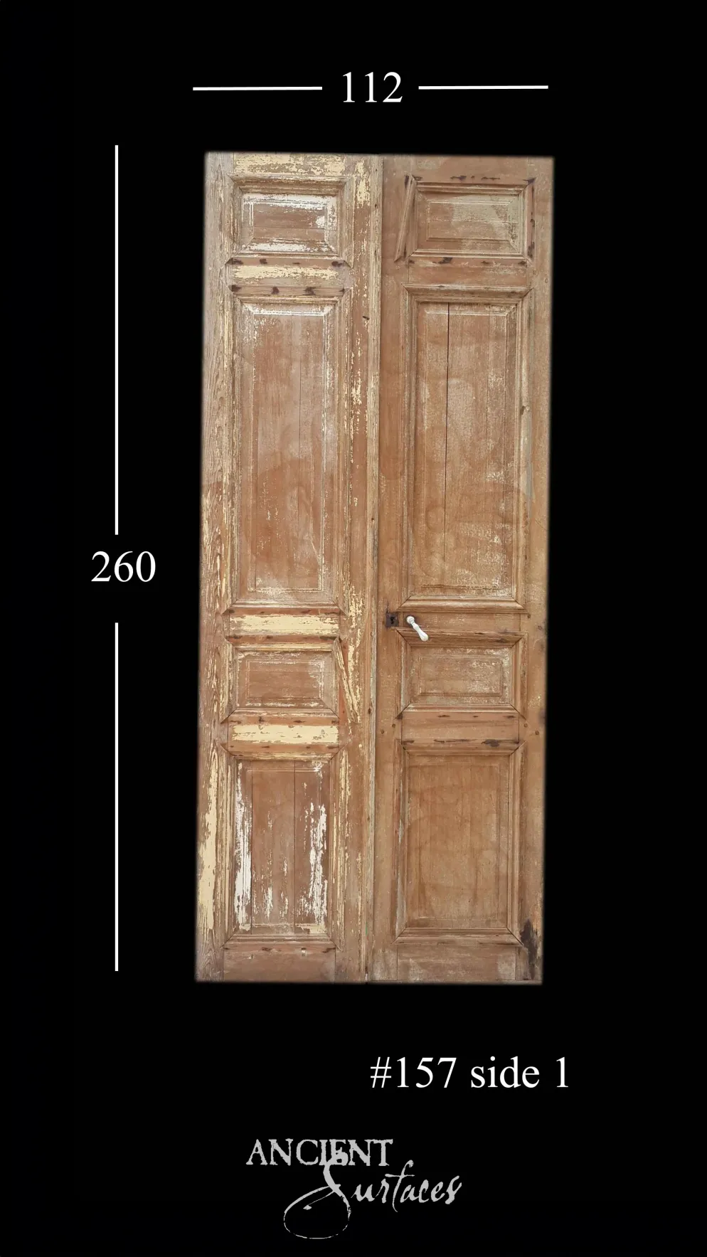 Stripped raw-wood reclaimed antique double door with six raised panels and a porcelain handle