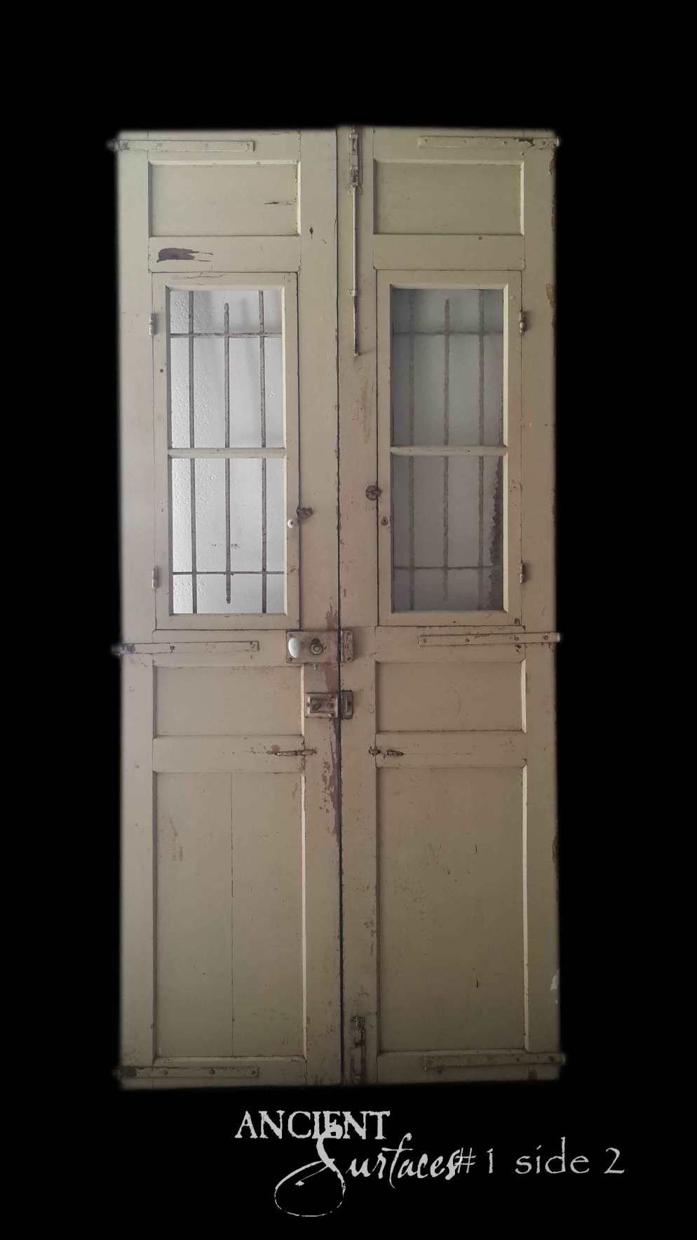 Sage-green reclaimed antique double door with barred glazed upper panels and porcelain knob