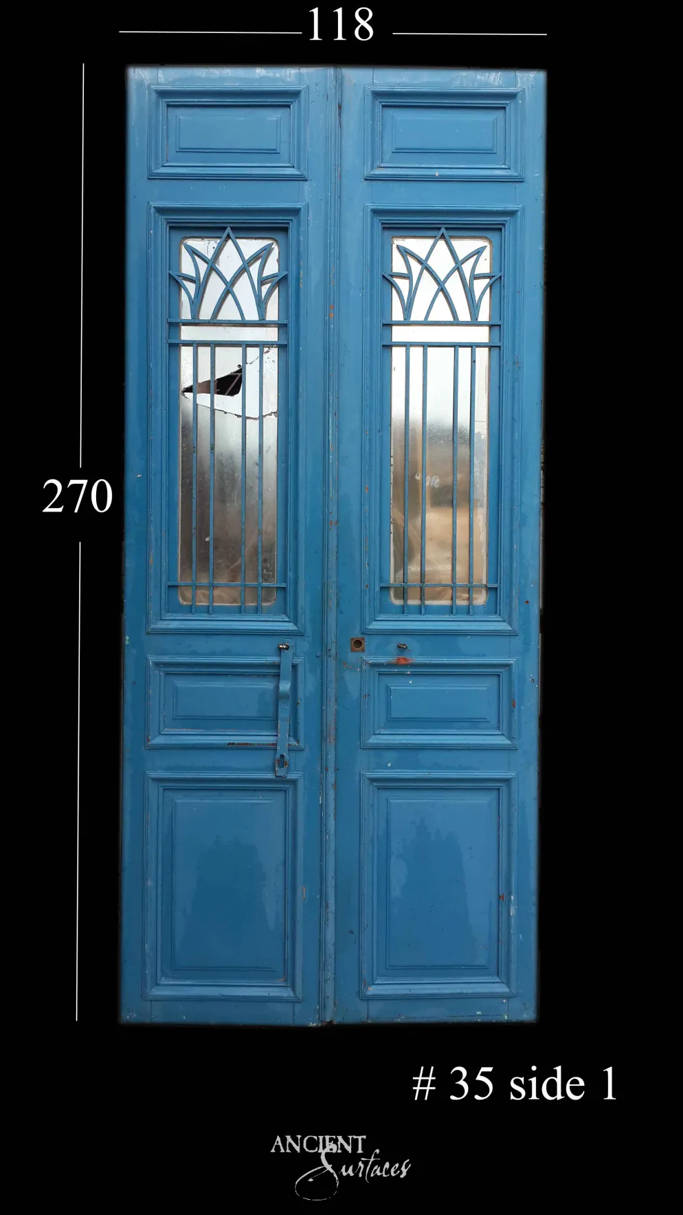 Cobalt-blue reclaimed antique double door with a lotus wrought-iron grille over mirrored glass